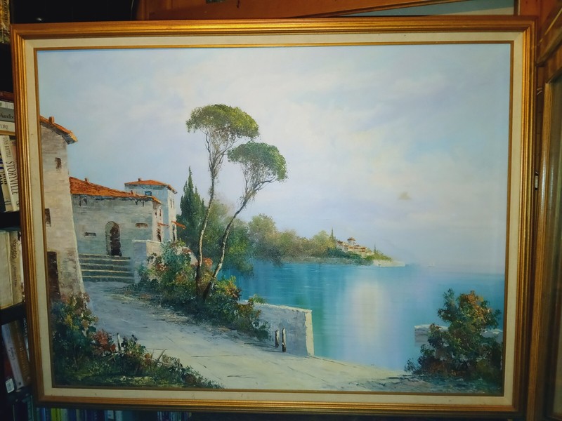 Framed Oil Painting of a Seaside Villa Signed By C. Loft (48″w X 36”h)