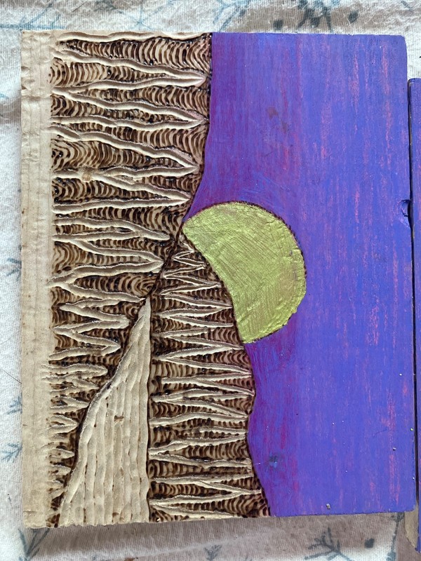 Tryptich hand puppeteering a hawk over a mountain landscape done in wood burning gallery