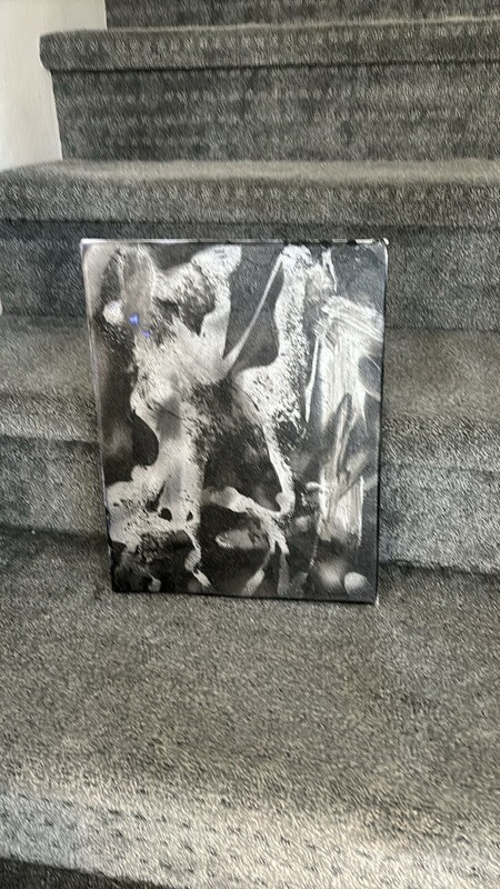 A beautiful silver and black painting, approximately 15” x 13”