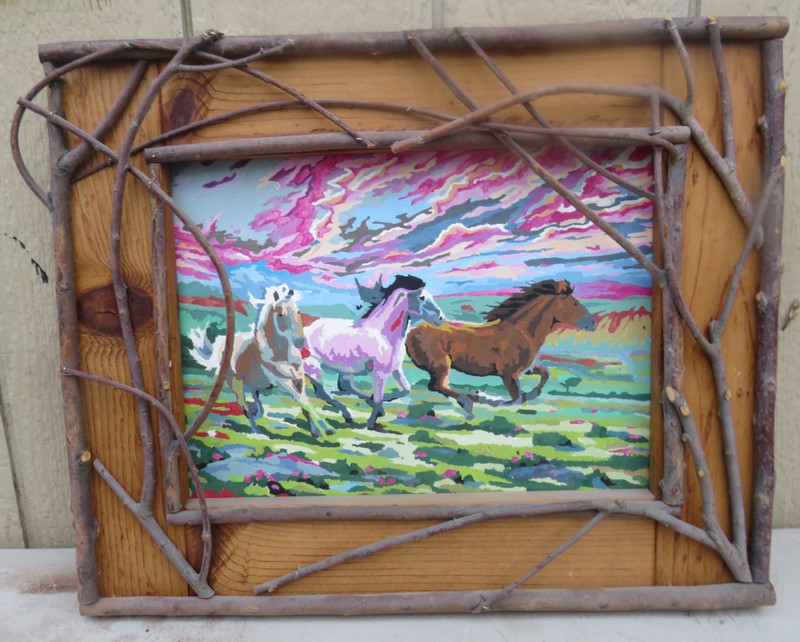 UNIQUE RUSTIC TWIG FRAMED PAINTING ON CARDBOARD OF RUNNING HORSES gallery