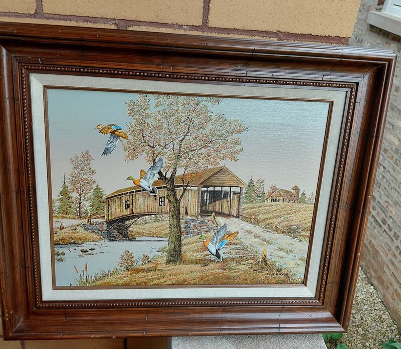 C. Carson Art serigraph ducks flying over a covered bridge. 22″ X 18″ Framed
