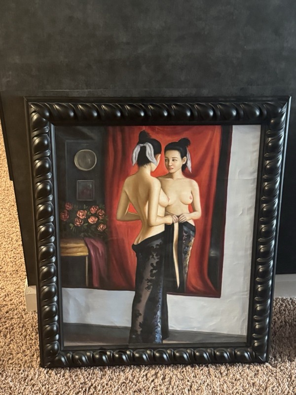 A Young Oriental Woman Looking at the Mirror,” a late 19th‑century oil on canvas