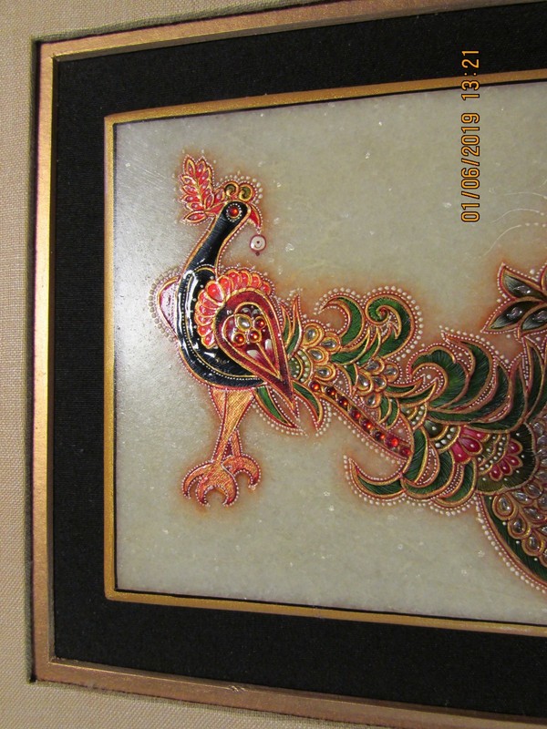 Indian peacock on marble slab