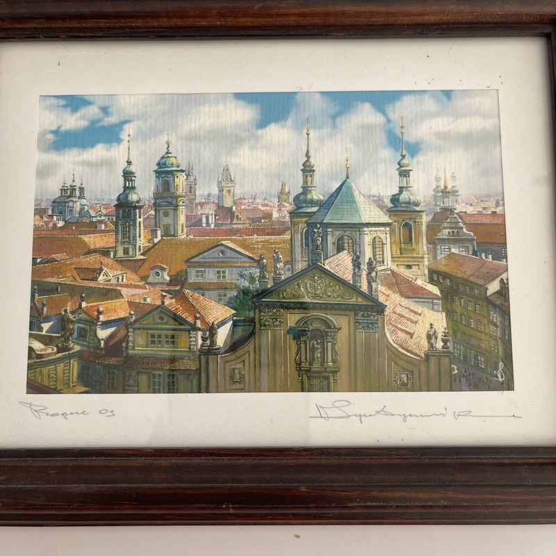 Watercolor painting of a cityscape, identified as Prague in 2003, and signed