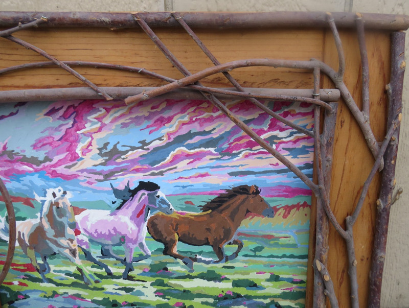 UNIQUE RUSTIC TWIG FRAMED PAINTING ON CARDBOARD OF RUNNING HORSES gallery