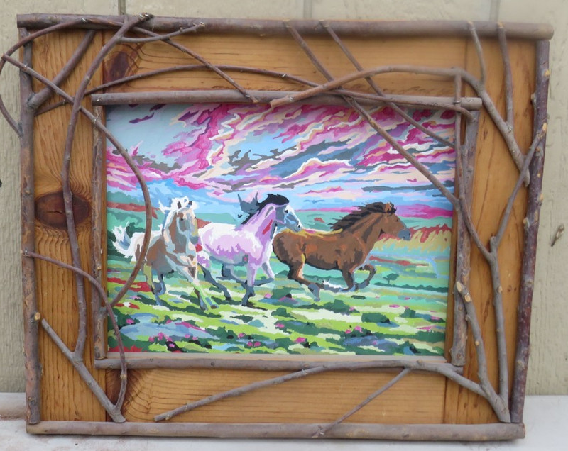 UNIQUE RUSTIC TWIG FRAMED PAINTING ON CARDBOARD OF RUNNING HORSES