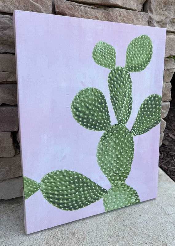 pink and green catus wall art measures 12 inches wide by 16 inches tall