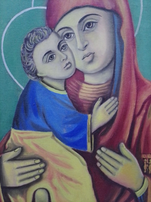 A picture with the image of the Mother of God on canvas with oil paints.