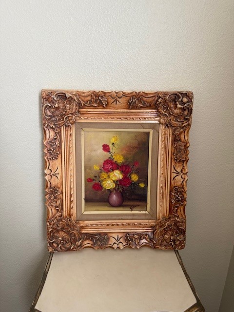 J. Berman painting still life painting of red and yellow roses in a vase